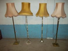 FOUR FLOOR STANDING STANDARD LAMPS AND SHADES, ONE IN BRASS