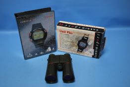 A PAIR OF BINOCULARS AND TWO BOXED CARDIO HEART MONITORS