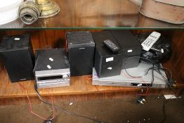 A SHARP DVD PLAYER TOGETHER WITH A PHILLIPS CD PLAYER AND SPEAKERS