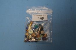 A BAG OF ASSORTED GEMSTONES
