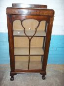 A NARROW LOCKING CHINA CABINET MADE BY THOMAS CLARKSON & SONS, WOLVERHAMPTON
