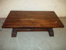 A LARGE HEAVY COFFEE TABLE