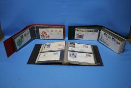 THREE ALBUMS OF FIRST DAY COVERS