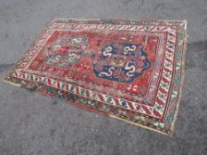 A VINTAGE WOOLLEN RUG