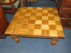 AN UNUSUAL LOW OAK COFFEE TABLE WITH APPLIED PARQUET STYLE TILES - SOME LOOSE H-38 W-84 CM