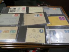A FIRST DAY COVER ALBUM CONTAINING WAR TIME STAMPS AND HISTORICAL INTEREST EXAMPLES, EARLY USA FIRST