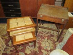 A RETRO TILE TOPPED NEST OF TABLES W-57 CM (LARGEST) AND A VINTAGE CHILDS DESK (2)