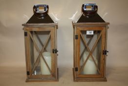 A PAIR OF DECORATIVE MODERN CANDLE LANTERNS, HEIGHT 45 CM