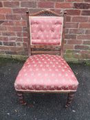 AN EDWARDIAN CARVED MAHOGANY CHAIR