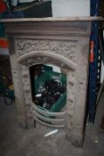 A CAST METAL FIRE SURROUND