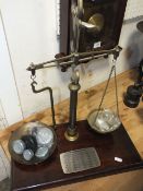 A SET OF VINTAGE BRASS AND MAHOGANY POSTAL SCALES WITH WEIGHTS