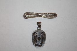A SILVER BOW TIE SHAPED BROOCH TOGETHER WITH A PENDANT
