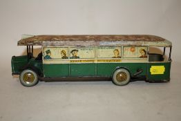 A VINTAGE FRENCH TIN PLATE WIND UP BUS TOY