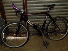 A PURPLE ALUMINIUM TREK BICYCLE