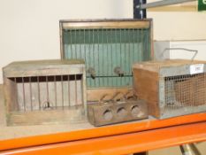 A COLLECTION OF SMALL ANIMAL TRAVEL CASES AND TRAPS