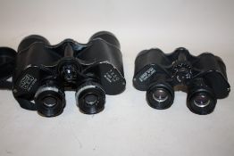 A PAIR OF LICHTER K.O.C 7X50 FIELD BINOCULARS TOGETHER WITH A PAIR OF RUSSIAN 8X30 BINOCULARS