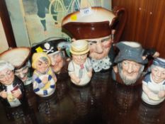 FOUR ROYAL DOULTON 'DOULTONVILLE' FIGURES TOGETHER WITH FOUR CHARACTER JUGS TO INCLUDE LONG JOHN