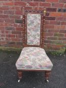 AN EDWARDIAN CARVED MAHOGANY PRAYER STYLE CHAIR