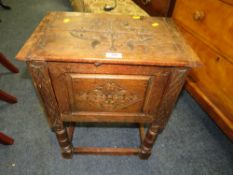 A SMALL CARVED OAK SEWING BOX H-57 W-45 CM