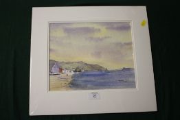 AN UNFRAMED MOUNTED WATERCOLOUR, OF PORTH DINLLAEN, SIGNED J. BENNETT, 28.5 X 23.5 CM