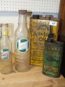A VINTAGE ALFA-LAVAL OIL CAN TOGETHER WITH TWO CASTROL MOTOR OIL BOTTLES AND A LUVAX SHOCK
