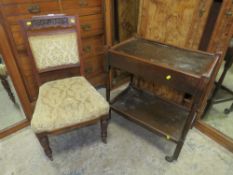 A CARVED MAHOGANY CHAIR AND AN OAK TROLLEY (2)