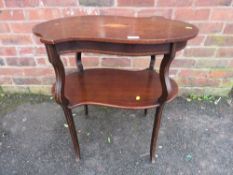 AN ANTIQUE MAHOGANY INLAID SHAPED TWO TIER TABLE W-89 CM A/F