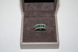 A WHITE GOLD EMERALD AND DIAMOND RING, set with an estimated 1.20 carats of emeralds and twenty