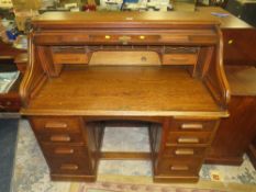 AN EARLY 20TH CENTURY OAK 'S' TAMBOUR ROLL TOP DESK