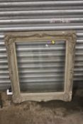 AN ANTIQUE GILT PICTURE FRAME WITH GLASS REBATE SIZE - 51.5CM X 62CM S/D