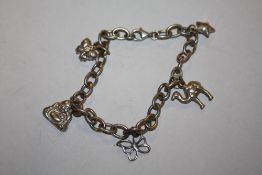 A STERLING SILVER CHARM BRACELET, APPROX WEIGHT 15.9 G