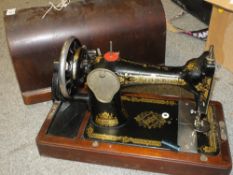 A CASED VINTAGE SINGER SEWING MACHINE