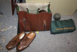 A LEATHER BAG OF HENSELITE LAWN BOWLS WITH SHOES AND A BAG OF GARDEN BOULES