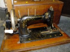 AN INLAID MAHOGANY CASED ANTIQUE FRISTER AND ROSSMANN SEWING MACHINE