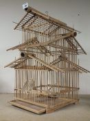 A WOODEN/CANE BIRD DISPLAY CAGE