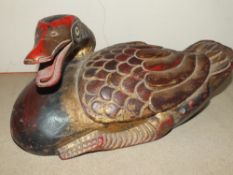 AN INDONESIAN STYLE CARVED HARDWOOD FIGURE OF A DUCK, LENGTH 33 CM