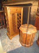 A COLONIAL STYLE HARDWOOD BOUND LIDDED OCTAGONAL BOX H-45 CM AND A PINE WINE RACK (2)