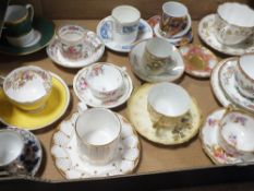 A TRAY OF ANTIQUE AND LATER CUPS AND SAUCERS TO INCLUDE ADDERLEY, COALPORT AND LIMOGES EXAMPLES