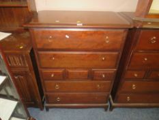 A STAG MINSTREL SEVEN DRAWER CHEST - FOUR HANDLES MISSING