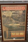 A REPRODUCTION FRAMED AND GLAZED LONDON RAILWAY INTEREST PRINT ENTITLED 'UNDERGROUND WINTERS