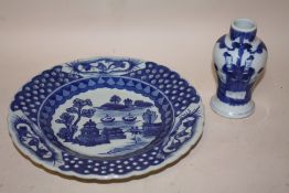 A BLUE AND WHITE ORIENTAL PLATE WITH FOUR FIGURE BACK STAMP TOGETHER WITH A BLUE AND WHITE