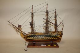A HAND BUILT WOODEN MODEL OF A GALLEON, H 35.5 CM