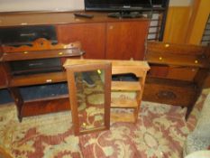 AN EDWARDIAN HANGING SHELF, A 1930;S OAK PAPER RACK, A PINE SHELF AND A MIRROR (4)