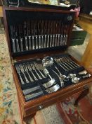 A LEATHER TOPPED MAHOGANY CASED COOPER LUDLAM CANTEEN OF CUTLERY, RAISED ON LEGS TOGETHER WITH OTHER