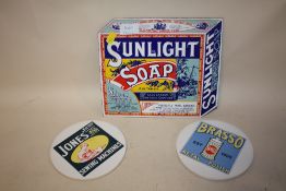 A REPRODUCTION ENAMEL ADVERTISING SIGN FOR SUNLIGHT SOAP TOGETHER WITH TWO CERAMIC ADVERTISING
