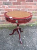 A SMALL REPRODUCTION DRUM STYLE OCCASIONAL TABLE