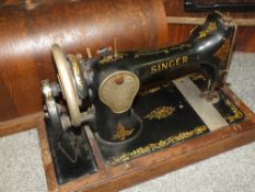 A CASED VINTAGE SINGER SEWING MACHINE