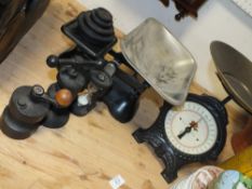 TWO SETS OF CAST METAL SCALES TOGETHER WITH A CAST METAL TABLE TOP PRESS AND A PEPPER GRINDER
