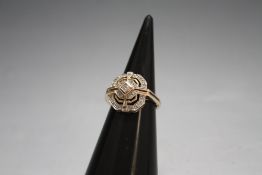 A HALLMARKED 9 CARAT GOLD DIAMOND RING, set with a quarter carat of diamonds, approx weight 3.8g,
