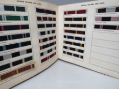 A VINTAGE MOSS BROS TEXTILE REFERENCE BOOK OF OLD BOYS, UNIVERSITY, CLUB AND REGIMENTAL COLOURS,